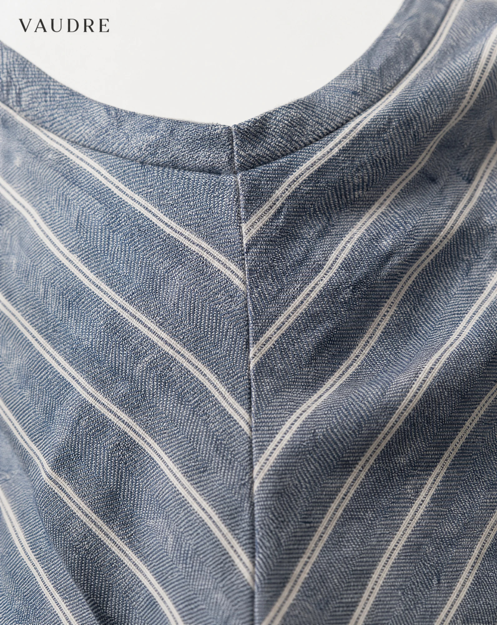 Chambray Blue Chevron-Stripe Cross-Back Mini Dress — Chambray Blue Dusty Denim Blue with Iv — the linen edit — VAUDRE numbered luxury — view 5