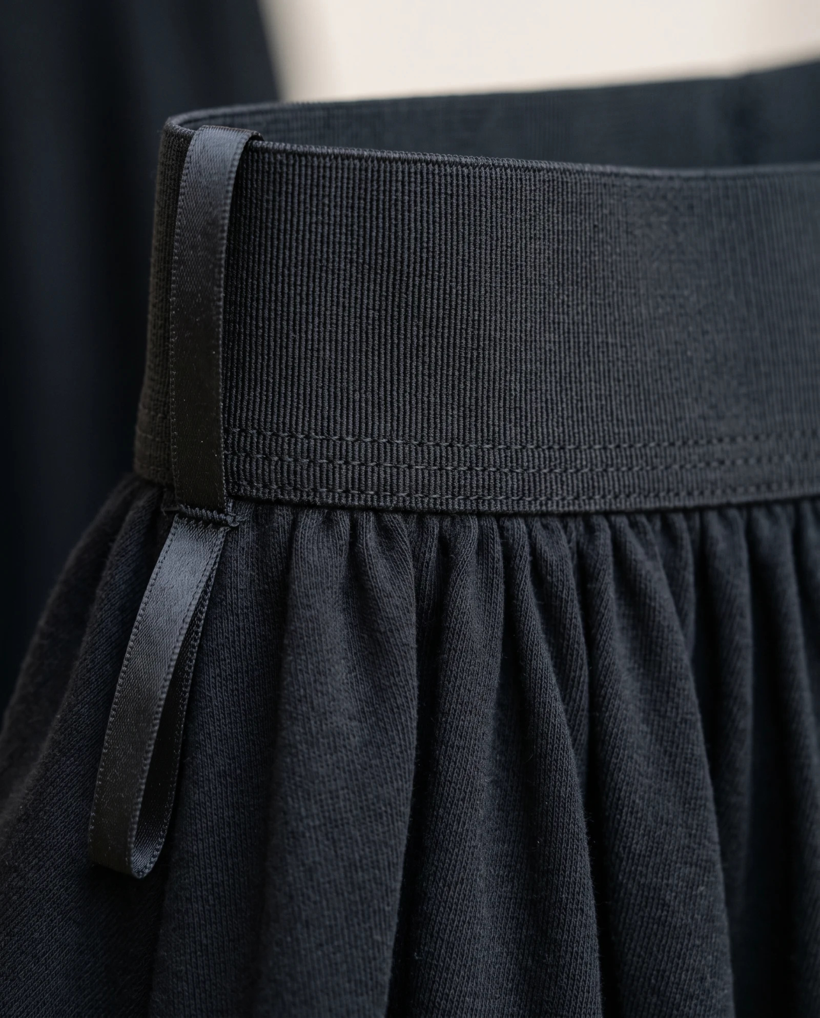 The Flared Rib-Waist Modal Maxi Skirt — Obsidian Black — the skirts — VAUDRE numbered luxury — view 5