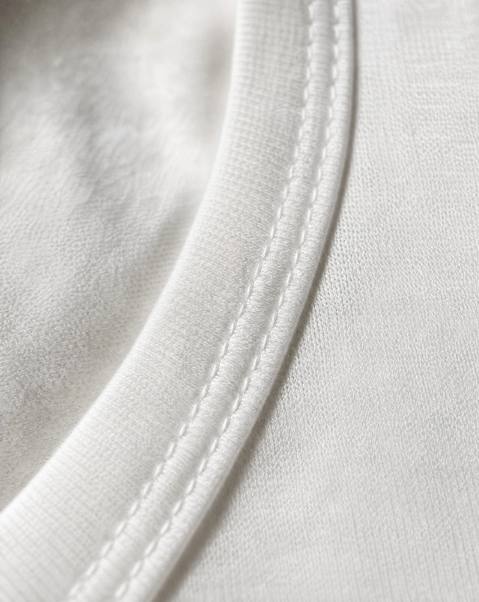 The Ivory Relaxed Sleeveless Crop Tank — Pure Ivory White — crop tops — VAUDRE numbered luxury — view 5